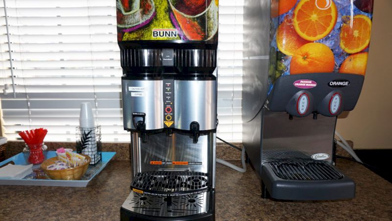 Two beverage dispensers on a countertop